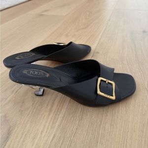 Tod's Black Leather Buckle Slide Mules with Gold Accent